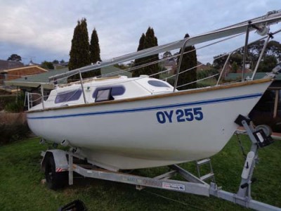 Starboard side view of QUMBU in the workshop (parked on my front lawn), with damaged gunwale, ready for surgery.
