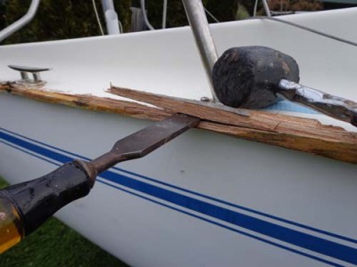 Brute force with hammer and chisel was the only real way to dislodge the well-adhered wooden gunwales.