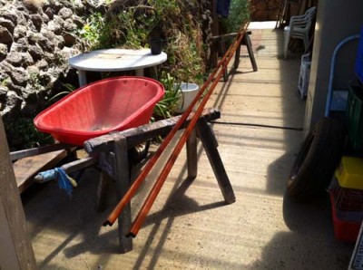 Oiled wooden rails drying in the warm shaded sun.