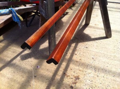 Closer view of wooden rail ends, showing the routed profile.