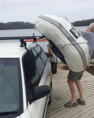 Lifting dinghy onto bars (Large).jpg