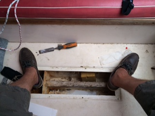 Centreboard case showing paper towel wicking away water in cavity of casing