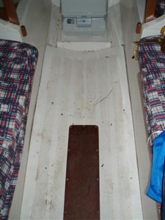 Here you can see the access hatch to the centreboard pivot.  The sole (floor) molding is usually glued down.