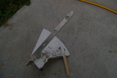 Forestay chainplate attachment, showing silicone spread on underneath