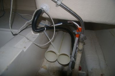Under-step area showing 10mm diameter tubing installed (with cable ties), ready to hold poles, etc under the cockpit sole.