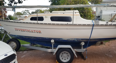 Side view of boat and trailer.png
