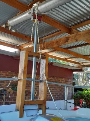 Telescopic mast crutch. Extends and gets the mast to 45 degrees before you need to add a boom vang to the fore-stay to raise it further. And that was more required coming down than going up.