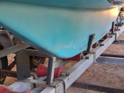 Keel guides. Minimalist yet worked brilliantly. Yes you do need to (roughly not exactly) line up the boat parallel with the trailer. But all happened easily in blustery, onshore conditions. Stainless steel construction courtesy of brother Rob and bolts on to the trailer chassis; plus no welding required.