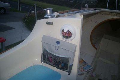 Port cabin side showing compass, tidy-bag and cam-cleats installed.