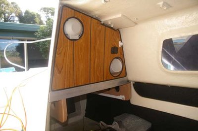 Port side showing rear of compass, chart tube and 12V power socket. The Ravia stove is not yet inserted at the bottom on its drawer runners.