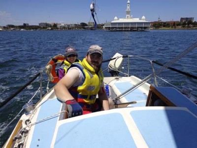 Kat and James at the helm, with Geelong in the background