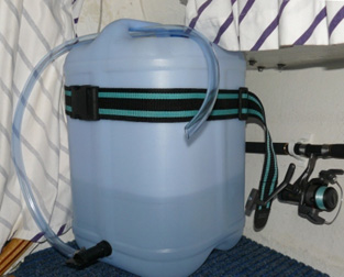 Water storage is a 25l plastic drum, secured with a luggage strap. We carry additional water as needed, but this arrangement allows easy access to the main supply. The water and other containers (tucker box etc) are arranged to allow the hatch over the porta pottti to be unrestricted.
